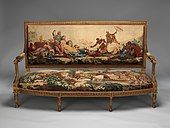 Louis XVI settee; designed in circa 1786, woven 1790–91, settee frame from the second half 19th century; carved and gilded wood, with wool and silk; 107.3 × 191.5 × 71.1 cm; Metropolitan Museum of Art