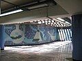 Picture of the mural below a ventilation sewer system.