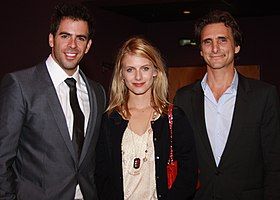 Laurent standing alongside Eli Roth and Lawrence Bender posing for the camera.