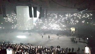 Listening party showing the stage with a wall above