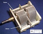 Double-tuning capacitor which are ganged together so that the capacitance of two bandpass filters can be changed simultaneously