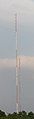 An antenna tower stands 446 feet (136 m) tall in Springfield, MO with its red and white aircraft warning paint visible