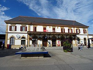 Wide two-story building with hip roof