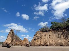 Moruga coastline. The south coast of the island of Trinidad is subject to severe coastal erosion. The soft sandstone rocks are constantly battered by rough seas. Stacks, arches, sand spits and lagoons are common coastal features along this coastline.