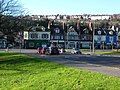 The major crossroads in the village, with the A23 London Road running north to south, Preston Drove (forming the northern boundary of Preston Park) to the east and North Road to the west. This view looks westwards from outside Preston Manor.