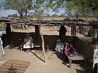 Charpais as daybeds in Rajasthan. Note diamond weave pattern.