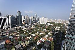 Bel-Air Village Phase 2 with skyscrapers most of which are also part of the barangay in the background