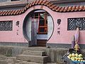 Public toilet in China, with female silhouette to the left and male to the right