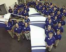 Levine poses with members of the ARES research team and a full-scale test airplane at the NASA Langley Research Center