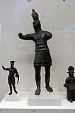 Copper-alloy of Horus (centre) as a Roman officer with contrapposto stances (National Archaeological Museum, Athens)