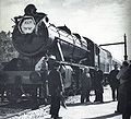 Stanier 8F 2-8-0 70513 heading the first Israel Railways service from Haifa to Hadera (4/1/1949), taking water at Zikhron Ya'akov station