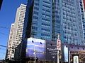 The advertising sheets and blue curtainwall glass in mid-August.