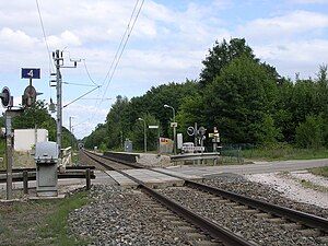 Platform next to single railway track at level crossing