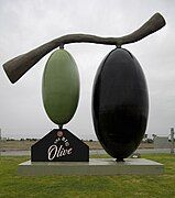 The Big Olive from front on, showing both the large green olive and the smaller black one.