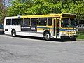 A highway coach bus at the University of British Columbia bus loop.