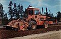 A Bomag MPH100 soil stabilizer aerating the soil ready for blending with lime