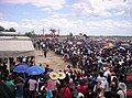 San Pedro Cutud Lenten Rites in City of San Fernando,Pampanga. There are three crosses with nailed men on the top of thehill with spectators, both local and foreigners, watching them.