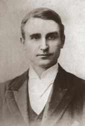 Head and shoulders photograph of young, clean-shaven white man in neat morning wear