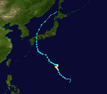 A track map showing the erratic path of a powerful typhoon over the western Pacific Ocean. The system moves northwestward at first, but then stalls before drifting to the east for a short distance. This motion is followed by a drift back to the west before the system resumes its previous northwestward trajectory. While located south of Japan, the system turns to the north, crossing the southwestern portion of the country. After emerging back over water, the system gradually assumes a northeastward motion, which it maintains until dissipation.