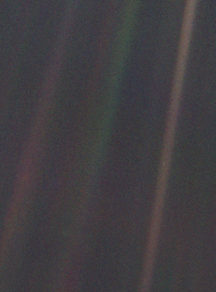 Dark grey and black static with coloured vertical rays of sunlight over part of the image. A small pale blue point of light is barely visible.