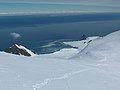 Catalunyan Saddle in the foreground, with Bransfield Strait in the foreground and the Antarctic Peninsula on the horizon