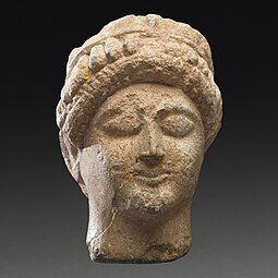 Female Votive Head Cyprus (?),[25] early 5th century B.C.