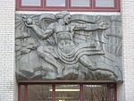 A relief of Prometheus giving fire to humanity on the facade of Remsen Hall.