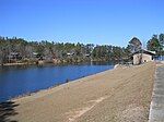 Rental cabins in background, along reservoir cove