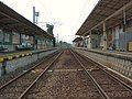 A view of the platforms and tracks from level crossing