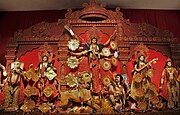 Durga Puja is a multi-day festival in Eastern India that features elaborate temple and stage decorations (pandals), scripture recitation, performance arts, revelry, and processions.[76]