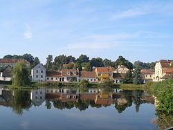 View across the pond in the centre of Uherčice