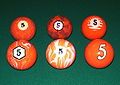 The 5 balls from various unusual, decorative sets of pocket billiards (pool) balls.