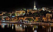 Belgrade at night, reflected in a river