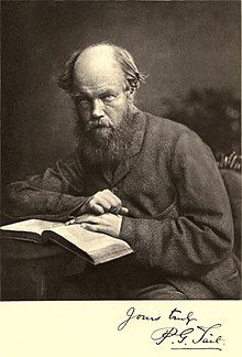 Black and white photograph of the Scottish physicist Peter Tait, seated with a book in his hands