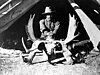 Carl Rungius astride a moose skull.