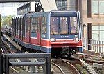 B92 stock train 57 arrives at Canary Wharf DLR station