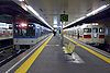 Trains at Kōsoku Kōbe Station in 2008