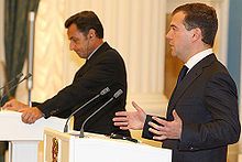 Two men standing at podiums