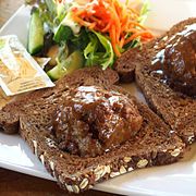 Broodje bal, a slice of bread with a meatball and gravy