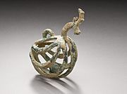 Western Iran, circa 1000-650 B.C. Bronze bell, 3 x 4 1/4 inches. Bell for goat?