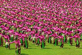 Balinese Tari pendet, performed by hundreds of dancers.