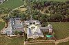 Aerial view from the south on Schloss Johannisberg in vineyards and park, Basilika and East Wing to the right