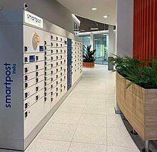 Smartpost's modern white parcel locker in Stockmann mall in Tallinn