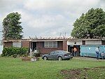 EF2 damage example--Well-built structures can suffer serious damage, including roof loss, and the collapse of some exterior walls may occur in poorly built structures. Mobile homes, however, are destroyed. Vehicles can be lifted off the ground, and lighter objects can become small missiles, causing damage outside of the tornado's main path. Wooded areas have a large percentage of their trees snapped or uprooted.