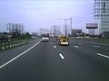 The North Luzon Expressway with 8 lanes traversing Valenzuela City southbound heading to Caloocan City and Quezon City.