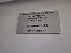 Bombardier's nameplate inside a gatwick airport shuttle car