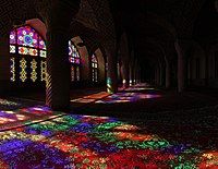 Extensive stained glasses of Nasir-ol-Molk Mosque in Shiraz, Iran, and the light passing through them