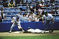 Image 45Rickey Henderson—the major leagues' all-time leader in runs and stolen bases—stealing third base in a 1988 game (from Baseball)