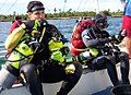 Technical divers preparing for a mixed-gas decompression dive in Bohol, Philippines. Note the backplate and wing setup with sidemounted stage tanks containing EAN50 (left side) and pure oxygen (right side).