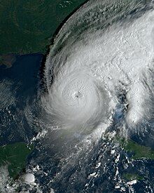 A satellite image that depicts Hurricane Ian, a category 5 hurricane, over southeastern portions of the Gulf of Mexico while approaching southwestern Florida on September 28, 2022. Timmer was stationed on Pine Island during the landfall of Hurricane Ian, which would occur several hours after the satellite image was taken.